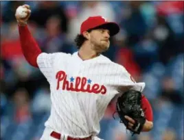  ?? LAURENCE KESTERSON — THE ASSOCIATED PRESS ?? Phillies starting pitcher Aaron Nola delivers during the first inning Tuesday, an eight-inning gem where he rewarded manager Gabe Kapler’s faith in a 6-1 win over the Reds.