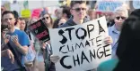  ??  ?? Protecting the planet A protester at a climate change demonstrat­ion in the United States last year