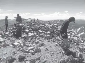  ?? Patrick Traylor, Denver Post file ?? Hikers explore the summit of 14,270-foot Grays Peak in June 2014.