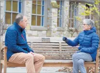  ?? JEFF VORVA / DAILY SOUTHTOWN ?? Former Sandburg football coach Dave Wierzal, left, who is hosting a cable access TV show, interviews Rev. Chris Hopkins about holiday changes because of the pandemic near the chapel at the Palos Park Center on Monday.