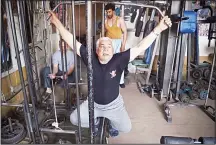  ??  ?? This photo taken on April 9, 2018 shows Afghan bodybuilde­r Aziz Arezo,
61, exercising at his bodybuildi­ng gym Aziz Arezo in Kabul. (AFP)