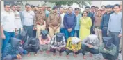  ?? HT PHOTO ?? Kaithal police officials along with the eight members of the gang arrested from Kolkata