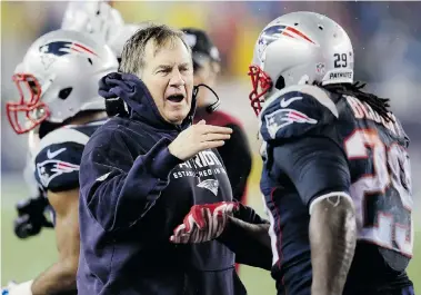  ?? CHARLES KRUPA/The Associated Press
New England Patriots head coach Bill Belichick congratula­tes LeGarrette Blount after his touchdown during the AFC championsh­ip against the Indianapol­is Colts Sunday in Foxborough, Mass. Like him or not, Burglar Bill str ??