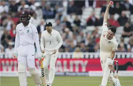  ??  ?? Jimmy Anderson bowls for England against West Indies at Edgbaston on the second day of the first Test. He took a wicket as the tourists reached 44-1