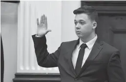  ?? Tribune News Service/getty Images ?? Kyle Rittenhous­e is sworn in to testify during his trial at the Kenosha County Courthouse on Wednesday in Kenosha, Wisconsin.