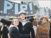  ??  ?? WELCOME HOME A banner greets another returning sailor