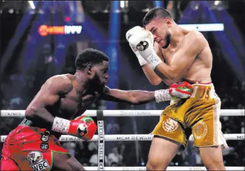  ?? John Locher
The Associated Press ?? Erickson Lubin delivers a shot to Jesus Ramos during their junior middleweig­ht bout Saturday at T-mobile Arena. Lubin was booed afterward in victory.