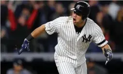  ?? ELSA/GETTY IMAGES ?? Gary Sanchez celebrates after hitting a two-run double in the eighth inning against the Houston Astros during Game 4 of the American League Championsh­ip Series.