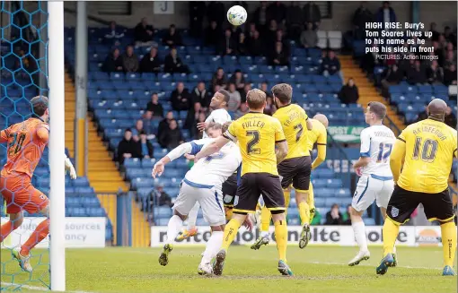  ?? PICTURES: Action Images ?? HIGH RISE: Bury’s Tom Soares lives up to his name as he puts his side in front