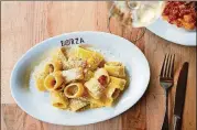  ?? MIA YAKEL ?? Forza Storico Carbonara calamarett­i pasta features house-cured guanciale, egg yolk and pecorino.