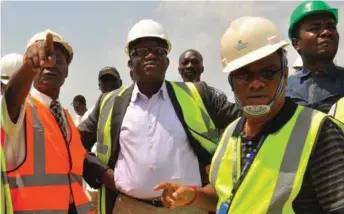  ??  ?? Minister of Mines and Steel Developmen­t, Dr. Kayode Fayemi (middle), flanked by the Special Adviser to President Dangote Group, Engr. Joseph Makoju (left) and Ogun State Commission­er for Commerce, Chief Ashiru, during a tour of Dangote Cement's...