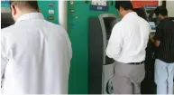  ?? File photo ?? VAT will be charged on Dh2, which is the fee to be paid when withdrawin­g money through another bank’s ATM. —