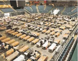  ?? — THE CANADIAN PRESS FILES ?? Cots are set up for evacuees from a summer of wildfires at the Sandman Centre in Kamloops, in July.