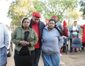  ?? Picture: Alex Matlala ?? COMFORTING. EFF Mopani regional chairperso­n Pontsho Mashumu with Kedibone Mashego, right, and another family member.