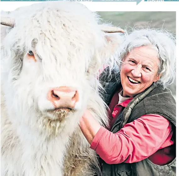  ?? Picture: Andrew Cawley ?? Rosie Douglas with Molly the Highland cow at Glendearg Farm, near Galashiels