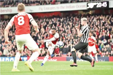  ?? — AFP photo ?? Arsenal's French striker Alexandre Lacazette (C) shoots but fails to score during the English Premier League football match between Arsenal and Newcastle United at the Emirates Stadium in London on April 1, 2019.