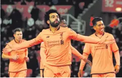  ??  ?? Main man: Mohamed Salah after netting the first of his double
