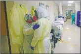  ?? (File Photo/AP/ Eric Gay) ?? Medical personnel talk as they care for covid-19 patients at DHR Health on July 29 in McAllen, Texas.