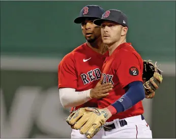  ?? MATT STONE / HERALD STAFF FILE ?? Xander Bogaerts, left, and Trevor Story celebrate a double play against Oakland in June.