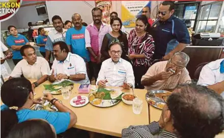  ?? PIC BY IQMAL HAQIM ROSMAN ?? PKR incoming president Datuk Seri Anwar Ibrahim (seated, centre), who is contesting in the Port Dickson by-election, meeting constituen­ts yesterday.