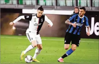  ?? AFP ?? Juventus forward Cristiano Ronaldo (left) vies with Inter Milan midfielder Matias Vecino in their team’s Italian Serie A football match at the Juventus stadium in Turin on March 8 last year.