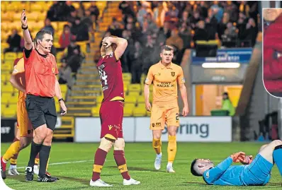  ??  ?? Motherwell’s Danny Johnson (centre) shows his frustratio­n as his effort is saved by Livi keper Kelly
