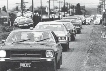  ?? PHOTO: OTAGO DAILY TIMES ?? Norman Kirk’s funeral procession heading towards Waimate Cemetery that grey September afternoon in 1974. The cortege had driven all the way from Christchur­ch, due to the bad weather.
