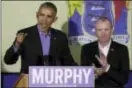  ?? JULIO CORTEZ — THE ASSOCIATED PRESS ?? Former President Barack Obama, left, speaks during a canvassing event for New Jersey Democratic gubernator­ial nominee Phil Murphy, right, Thursday in Newark, N.J.