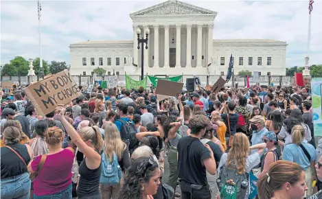  ?? ?? Abortion-rights protesters gather outside the US Supreme Court in Washington yesterday.