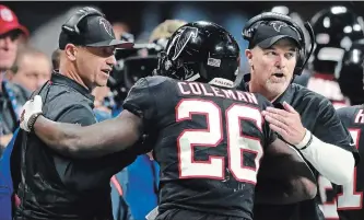  ?? CURTIS COMPTON
THE ASSOCIATED PRESS ?? Atlanta Falcons offensive co-ordinator Steve Sarkisian, left, and head coach Dan Quinn celebrate with running back Tevin Coleman after his touchdown run against the New York Giants on Oct. 22.