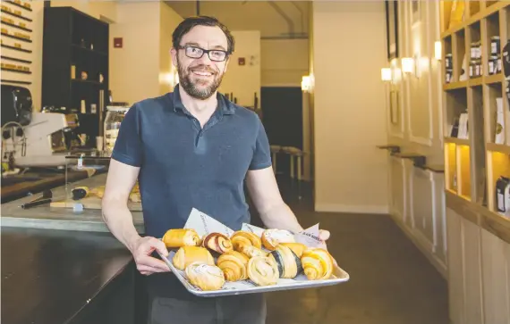  ?? GAVIN YOUNG ?? Black Sheep Bakery owner Benjamin Griffon shows off some of the delectable treats available at his bakery.