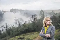  ??  ?? MAYOR Linda Dahlmeier flew home from a conference after hearing that water had begun washing down an emergency spillway in Oroville.