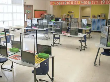  ?? THOMAS HAWTHORNE/THE REPUBLIC ?? A kindergart­en classroom at Dunbar Elementary is set up for students during the COVID-19 pandemic as schools in the Phoenix Elementary District reopened in March.