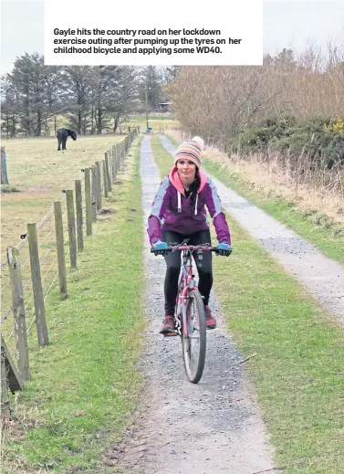  ??  ?? Gayle hits the country road on her lockdown exercise outing after pumping up the tyres on childhood bicycle and applying some WD40. her