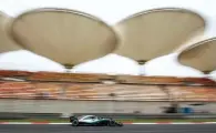  ?? — AFP ?? Mercedes’ Lewis Hamilton steers his car during the first practice of the Formula One Chinese Grand Prix in Shanghai.