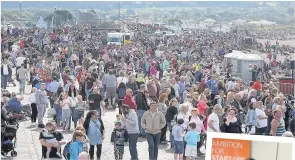  ??  ?? Cash call Airshow crowds and council’s Jill Cronin, right