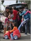  ??  ?? „ Migrants receive help at a shelter near the Us-mexico border.