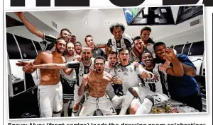  ??  ?? Bravo: Alves (front centre) leads the dressing room celebratio­ns