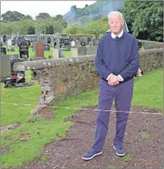  ?? 50_c38cemeter­ywall01 ?? Mr Baxter beside the broken section of wall which is now cordoned off.