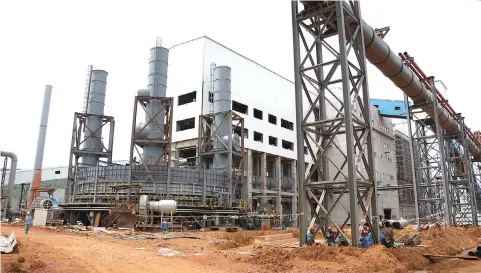  ?? ?? Manhize steel plant workers seated near the processing plant in Mvuma on Friday