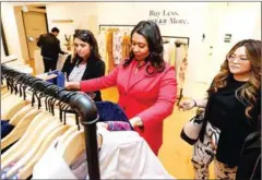  ?? KELLY SULLIVAN/GETTY IMAGES/AFP ?? San Francisco Mayor London Breed (centre) looks through racks during the launch of Rent the Runway’s West Coast flagship store on May 8 in San Francisco, California.