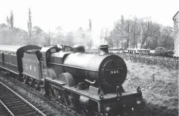  ??  ?? Recorded near Steeton & Silsden on
21 May 1938, Vulcan Foundry-built Compound No 931 is seen in charge of a Morecambe residentia­l express to either Leeds or Bradford. The residentia­l trains were an important feature of the ex-Little North Western Railway lines as many of the Bradford and Leeds mill owners and managers lived by the sea at Morecombe, thereby avoiding the heavily polluted airs of the two cities. Some residentia­l trains divided at Skipton, with the train engine working through to Leeds and another engine coming on to work the Bradford portion, while others ran direct to Bradford (Forster Square) or Leeds (Wellington Street). Completed in May 1927, No 931 was one of the Compounds fitted with exhaust injectors by the LMS – the pipe seen running from the smokebox is the steam feed. This locomotive would remain in traffic until November 1958, so ultimately served for about 31½ years, its final home being Lancaster (Green Ayre).