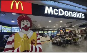  ?? (AP/Sakchai Lalit) ?? Customers enjoy a meal Friday at a McDonald’s in a shopping mall in Bangkok, Thailand.