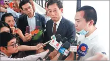  ?? CHINA DAILY ?? Global Times reporter Fu Guohao (right) talks to reporters at Princess Margaret Hospital in Hong Kong on Wednesday.