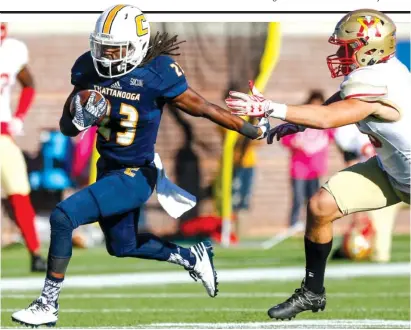  ?? STAFF FILE PHOTO BY DOUG STRICKLAND ?? UTC running back Richardre Bagley breaks away from VMI defensive back Greg Sanders on a touchdown run during the Mocs’ home. Bagley will be combining with top back Derrick Craine against Wofford this Saturday.