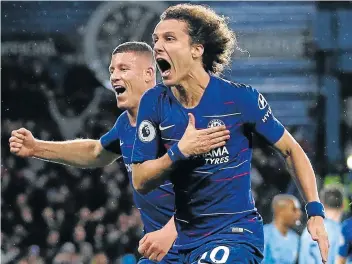  ?? Picture: AFP/ADRIAN DENNIS ?? IN CONTROL: Chelsea defender David Luiz, right, celebrates with teammate Ross Barkley after scoring Chelsea’s second goal during their Premier League match against Manchester City at Stamford Bridge in London on Saturday.