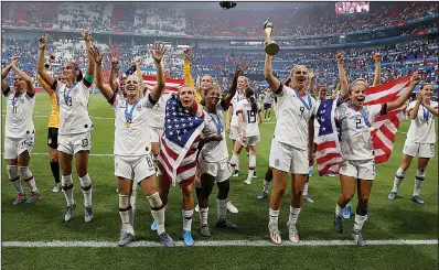  ?? Associated Press ?? Still champions: United States players celebrate their victory in the Women's World Cup final soccer match between US and The Netherland­s at the Stade de Lyon in Decines, outside Lyon, France, Sunday. US won 2:0.