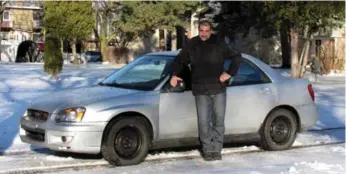  ?? COSTA MOUZOURIS PHOTOS ?? Wheels writer Costa Mouzouris, with his pride and joy — a 2004 Subaru Impreza RS sedan — are ready for a trouble-free winter. He spent $984 and several weeks fixing the car, which he purchased for $2,000.