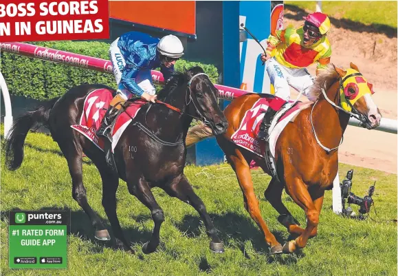  ?? Picture: GETTY IMAGES ?? Jockey Michael Walker aboard Mighty Boss celebrates winning the Caulfield Guineas yesterday ahead of Damian Lane (left) riding Kementari