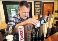  ?? AP/HAVEN DALEY ?? Big Sur Taproom and Deli owner Kurt Mayer pours a beer in Big Sur, Calif. earlier this month.